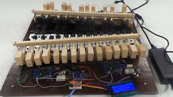 A wooden xylophone with electronic contraptions for robotic playback