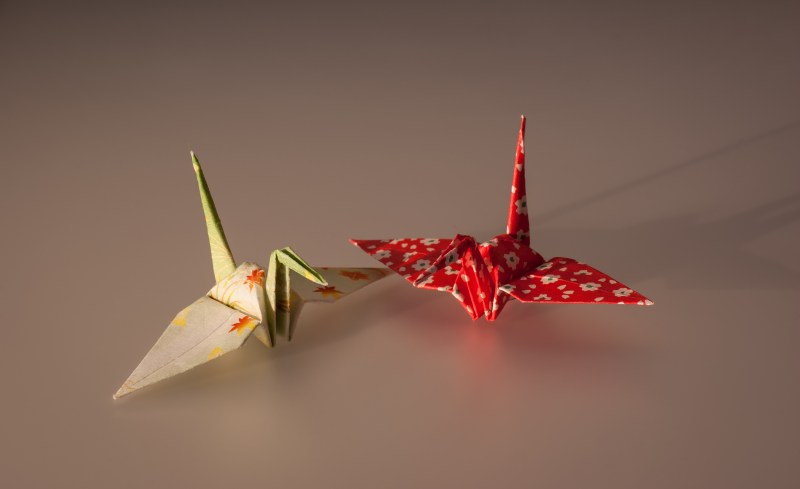 A photo of two crane origami paper.