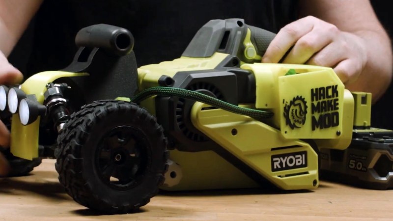 A Ryobi belt sander with remote control car parts