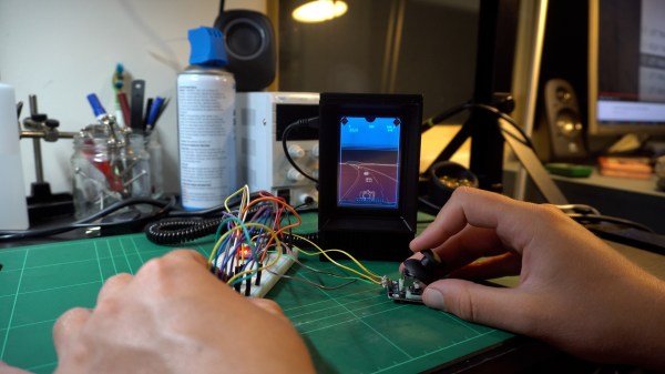 A miniature Vectrex console being used