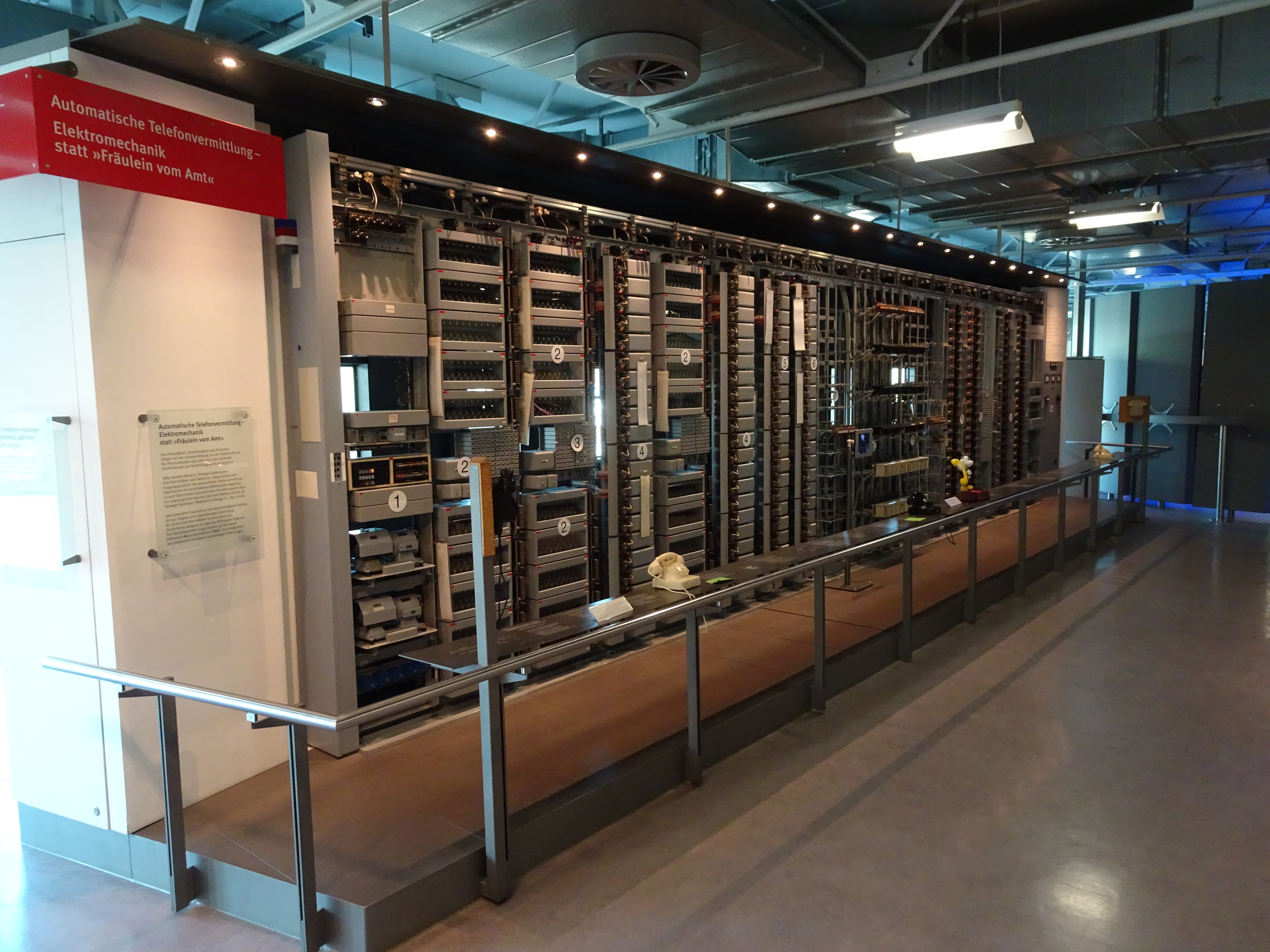 An electromechanical telephone exchange with a few rotary phones in front