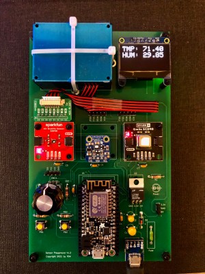 A large PCB with several sensor modules and a microcontroller