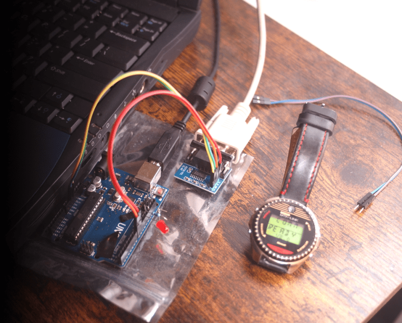 A Timex Datalink smartwatch next to an Arduino