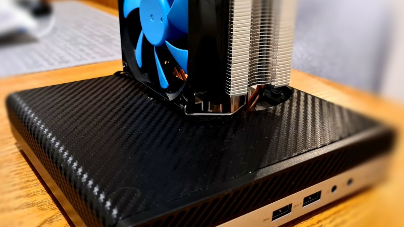 Mini PC with the mod described, a large tower fan sticking out of a hole in the top cover