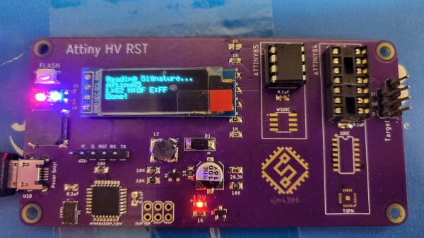 A purple PCB with an OLED display and various chips