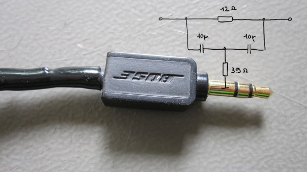 The Bose headphone plug in question, with reverse-engineered schematic of the filter overlaid.