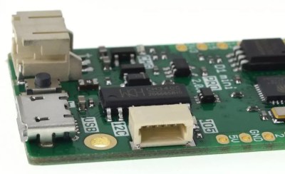 A Lolin board pictured with a JST-SH 4-pin connector marked I2C. Sadly, that connector has its own custom pinout.
