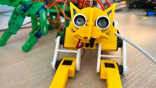 PicoCat, printed in yellow filament, looking at you with its ultrasonic sensor eyes