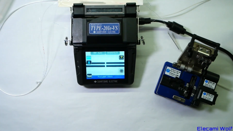 A fusion splicer being used to repair an optical fiber
