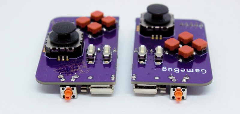 A pair of purple PCB-based game controllers