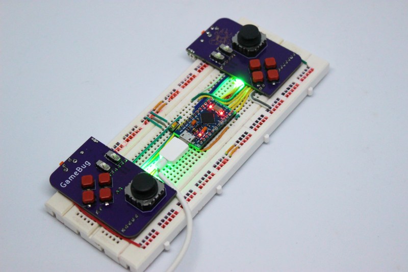 A pair of purple PCB-based game controllers on a solderless breadboard