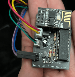 The intermediate board design, with an ATMega and an ESP-01 module on it, three connector-ended two-wire cables going away from the board.