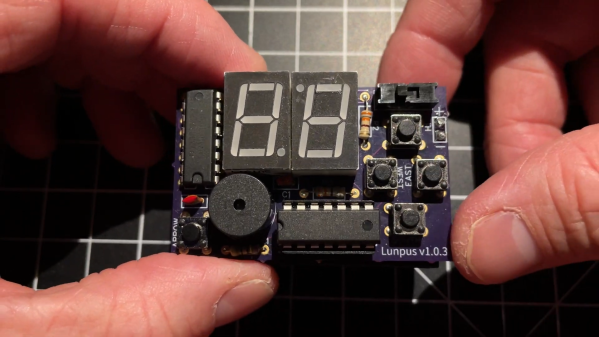 A small PCB with a microcontroller, two 7-segment LED displays, a speaker and some buttons