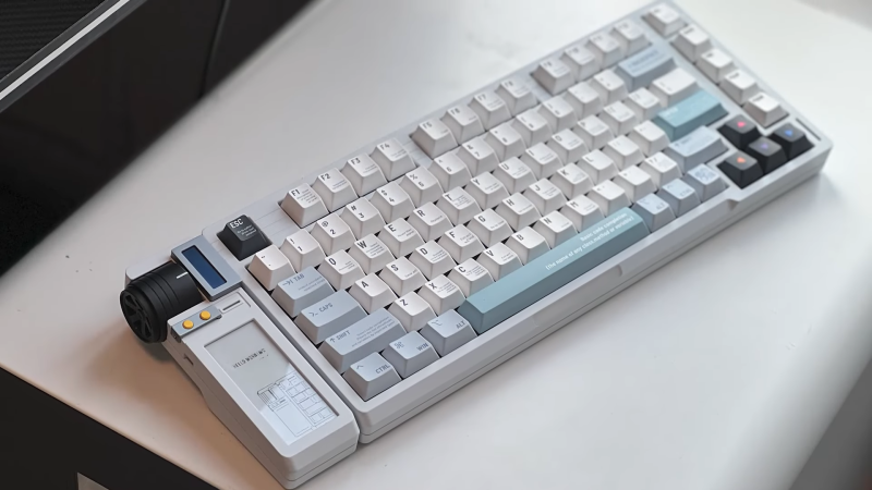 A mechanical keyboard with a haptic knob and E-ink display