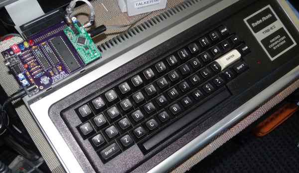 A TRS-80 with a small PCB attached