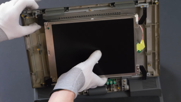 The LCD being replaced in an old laptop