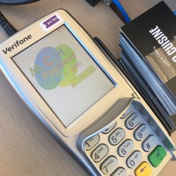 a Verifone terminal with the MCH Payment System logo on the screen