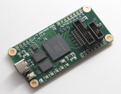 The ORBTrace board, with a FPGA in the center of it, a USB-C connector on the left, and two IDC debug connectors on the right (one ten-pin and one twenty-pin)
