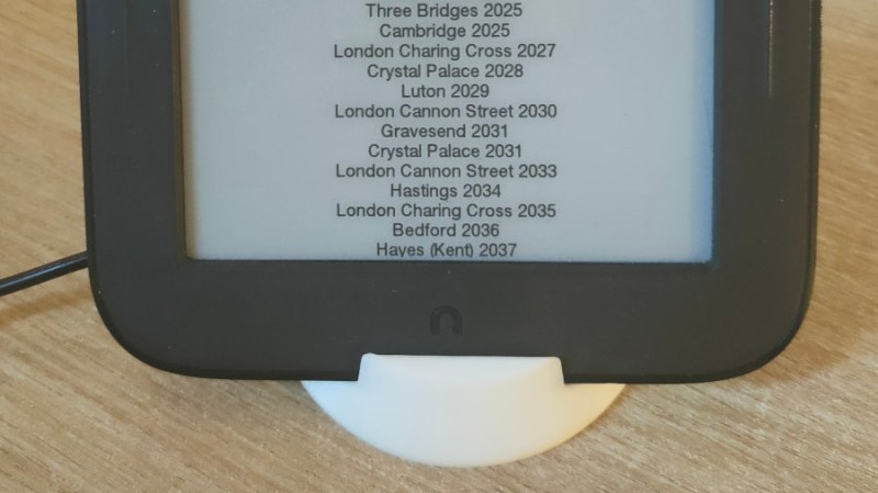 Tablet ina 3D printed stand, showing timetables on its screen
