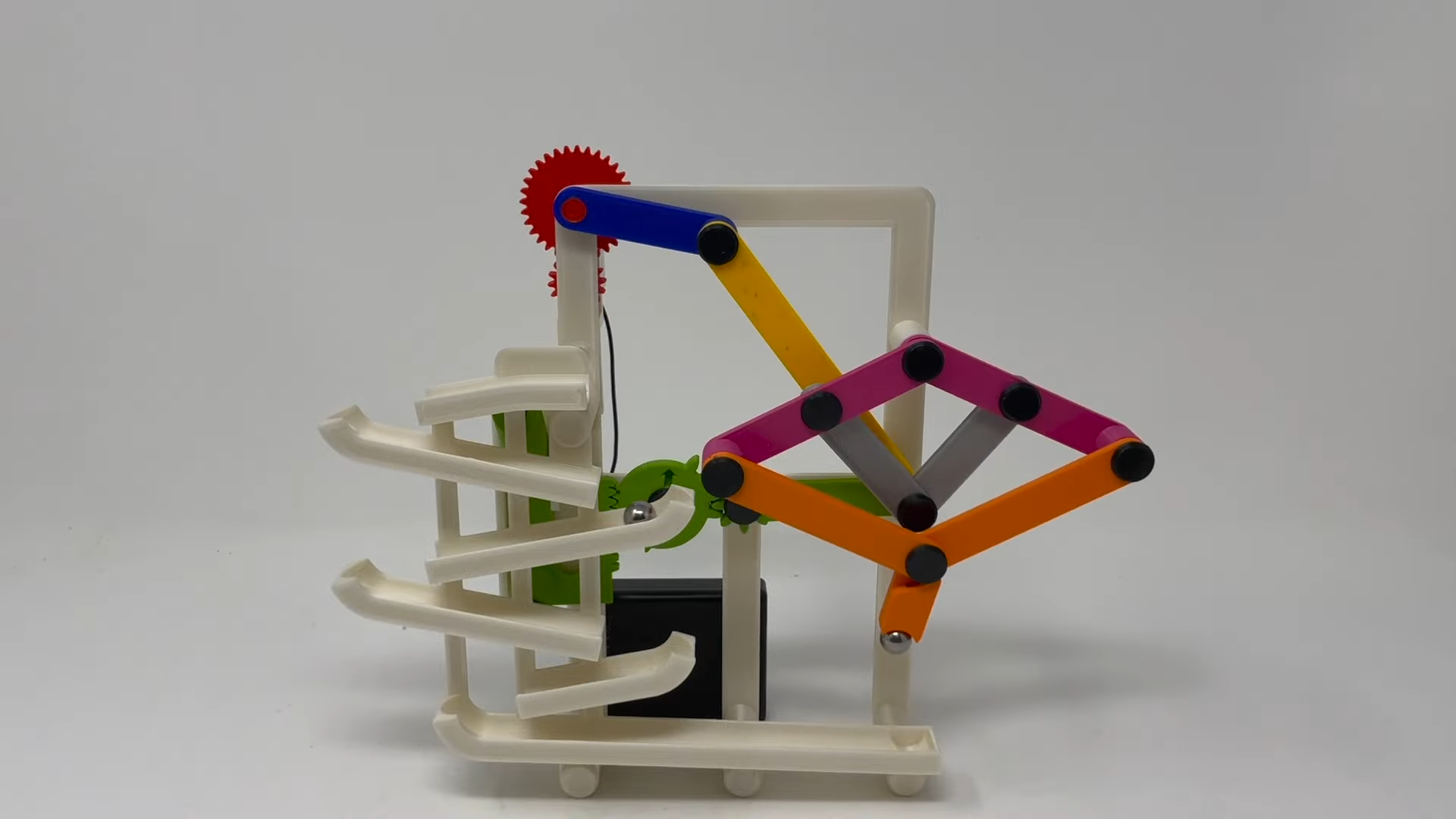 A 3D printed marble track features a neat elevator linkage