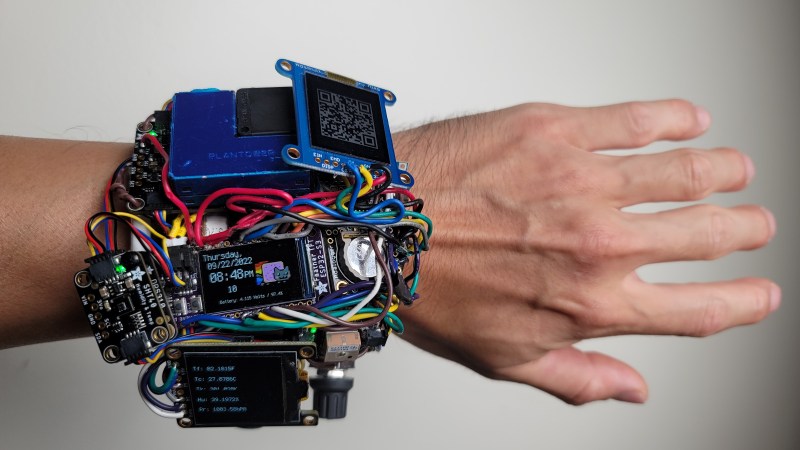 Watch on the wrist, with all the sensors facing the camera. There's a lot of them, and a lot of wires of all kinds tying everything together.