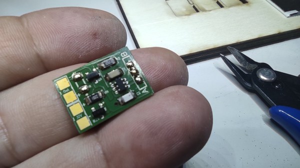 The assembled switch PCB in the palm of its creator's hand