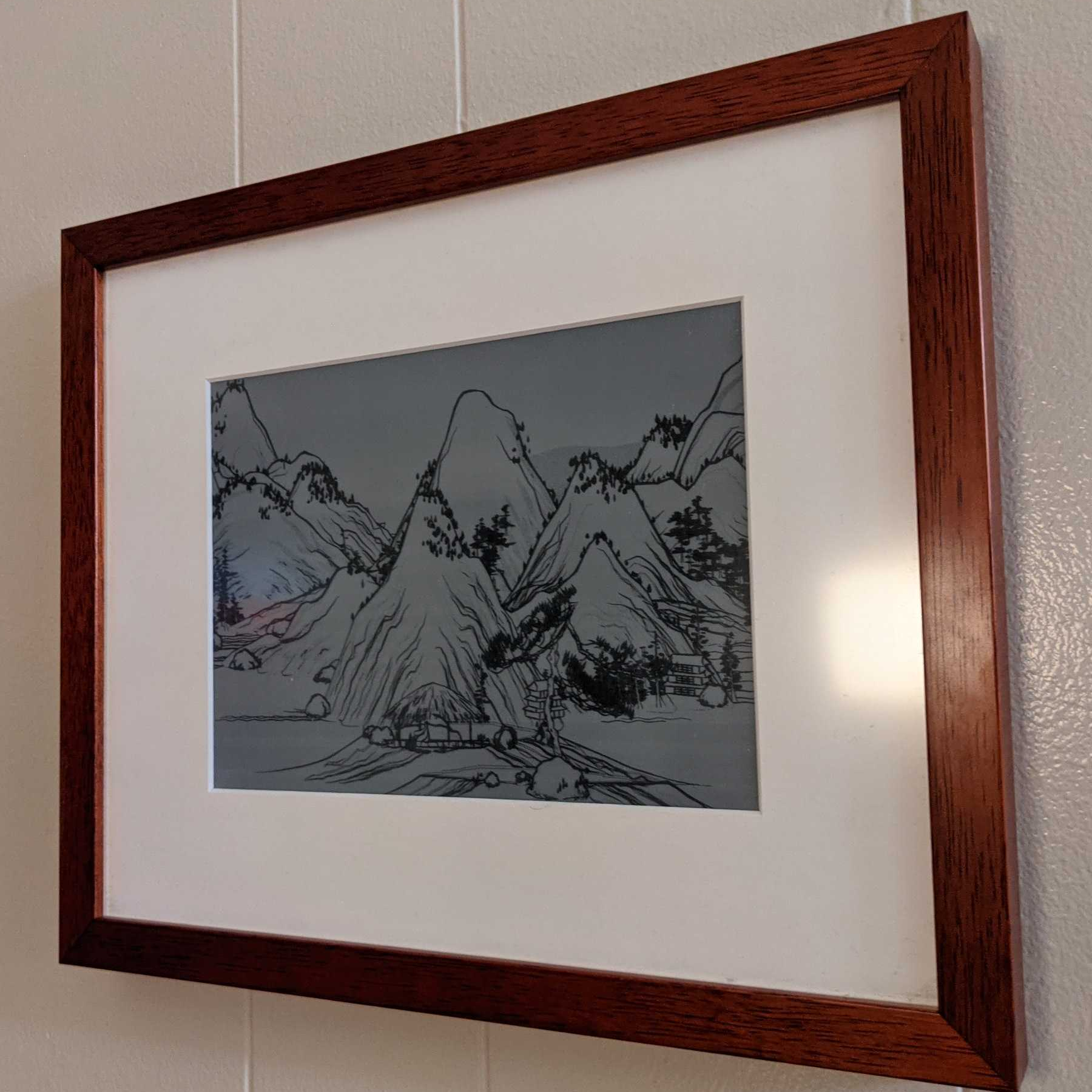 E-ink picture frame with infinitely scrolling landscape