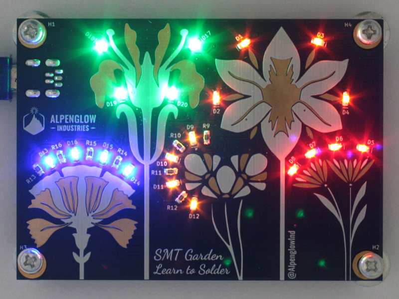 Front of PCB for "SMT Garden" with glowing LEDs