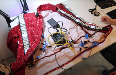 Inside of the LED thriller jacket, with battery pack, arduino nano and wiring exposed