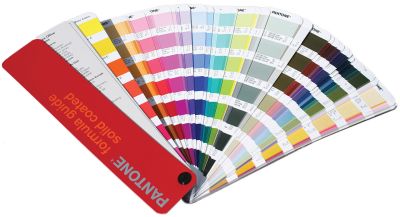 An open Pantone swatch book in a fan