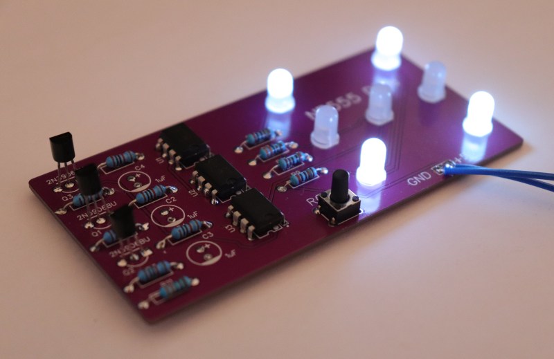 photograph of custom PCB assembly of NE555-based electronic dice