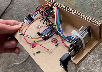 An optical mouse sensor mounted on a cardboard frame
