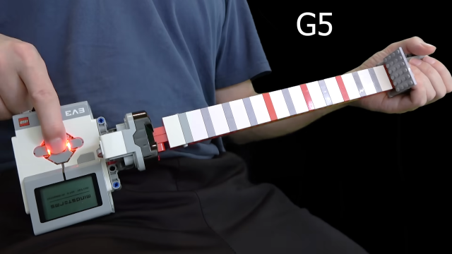Guitar made of LEGO skillfully played by fifth grader