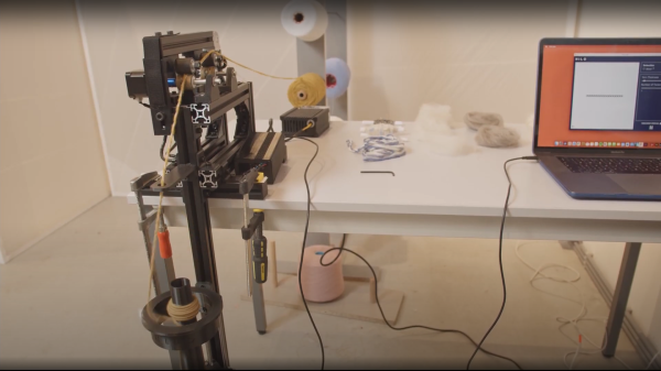 open hardware textile spinning machine constructed from aluminium extrusions, arduino electronics and 3D printed parts