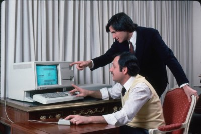 Steve Jobs and John Couch pointing at a Lisa. Totally not staged.