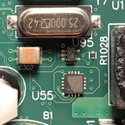 An unidentified IC on the a different counterfeit Cisco board, with markings soldered off