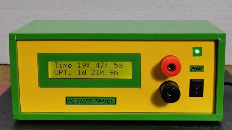A small 16x2 LCD display housed in a green and yellow hobby box.