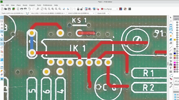 Screenshot of KiCad 7 feature that lets you overlay a PCB bitmap image and draw traces over it, being used for board reverse-engineering purposes