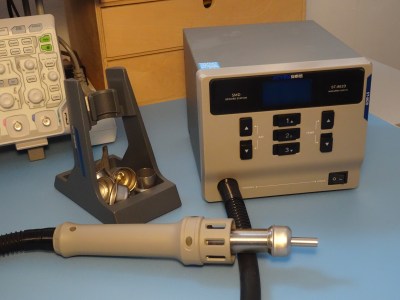 A hot air soldering station on a lab bench