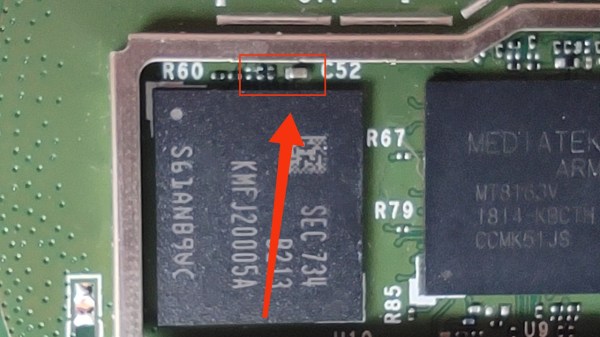 Photo of the Echo Dot PCB, highlighting the capacitor that needs to be shorted out for the exploit to work
