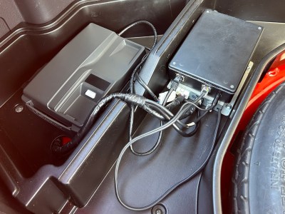 A car phone base station and wiring in the trunk of a Mitsubishi 3000GT