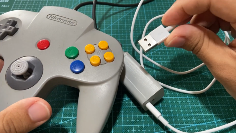 A Nintendo 64 controller with a USB adapter