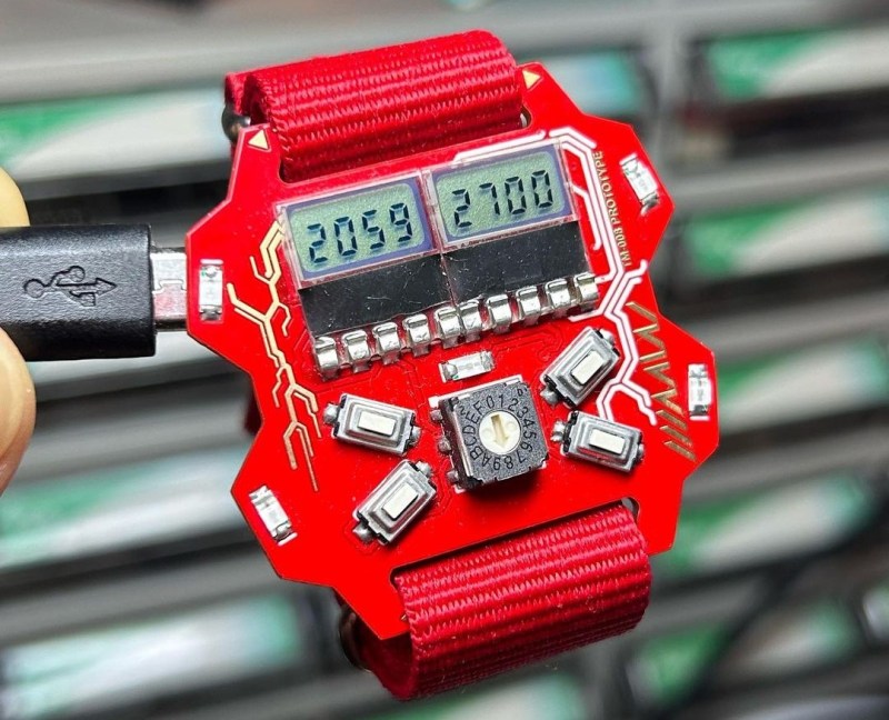 A wristwatch based on a red PCB with seven-segment LCD screens