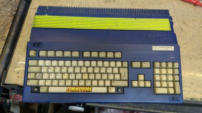 An Amiga 500 with a poor blue-and-yellow paint job