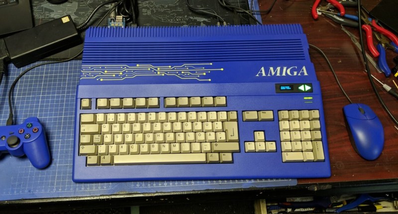 An Amiga 500 with a blue case and blue accessories