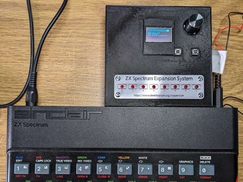 A ZX Spectrum with a Microdrive emulator plugged into its expansion port