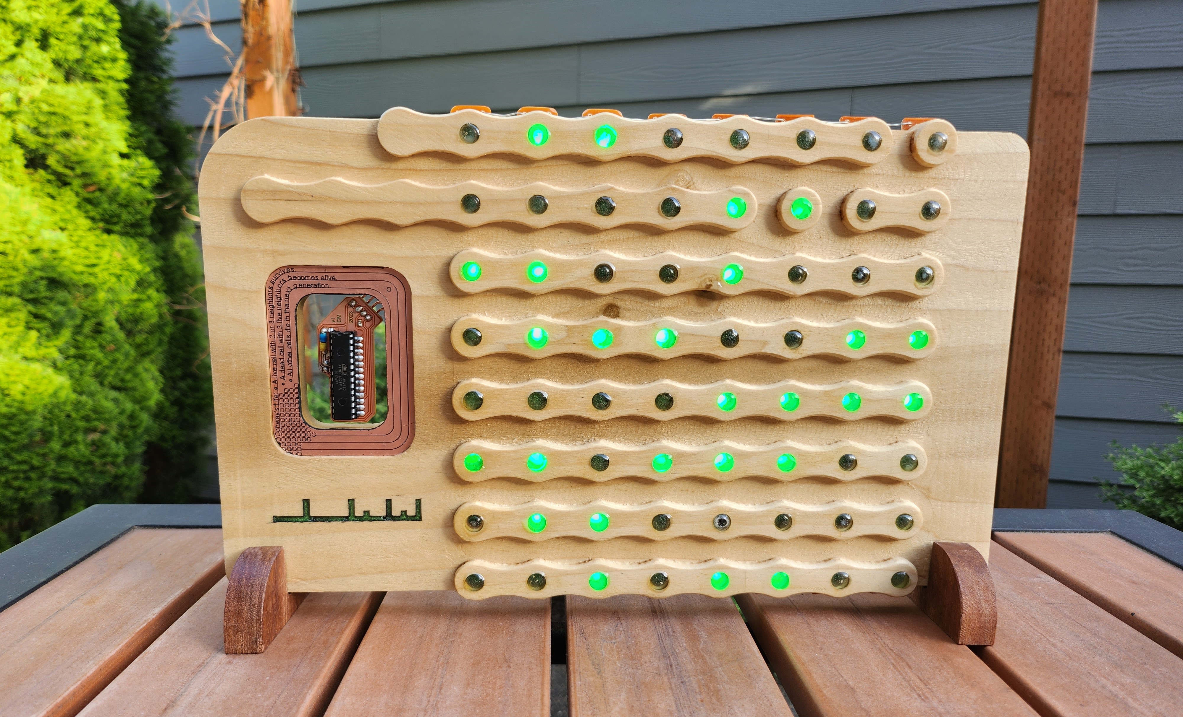 Wooden CNC carving features Conway's Game of Life