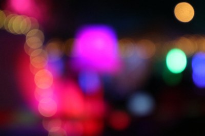 A picture of some coloured lights in the dark, intentionally out of focus