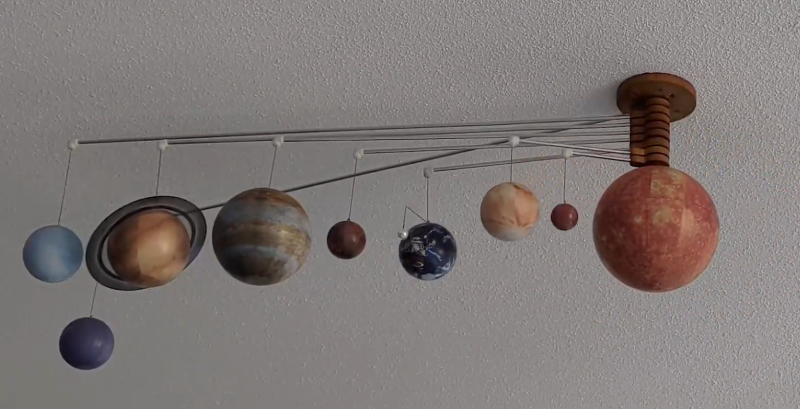 A ceiling-mounted model of the Solar System