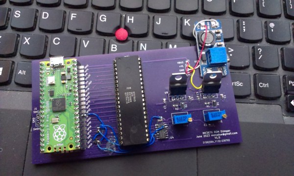 A purple PCB with a Raspberry Pi Pico and an MK3870 mask ROM microcontroller